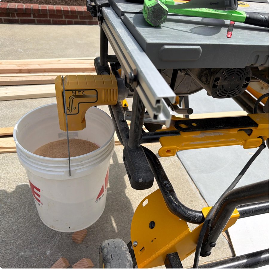Customer photo of a sawdust adapter collecting dust in a bucket